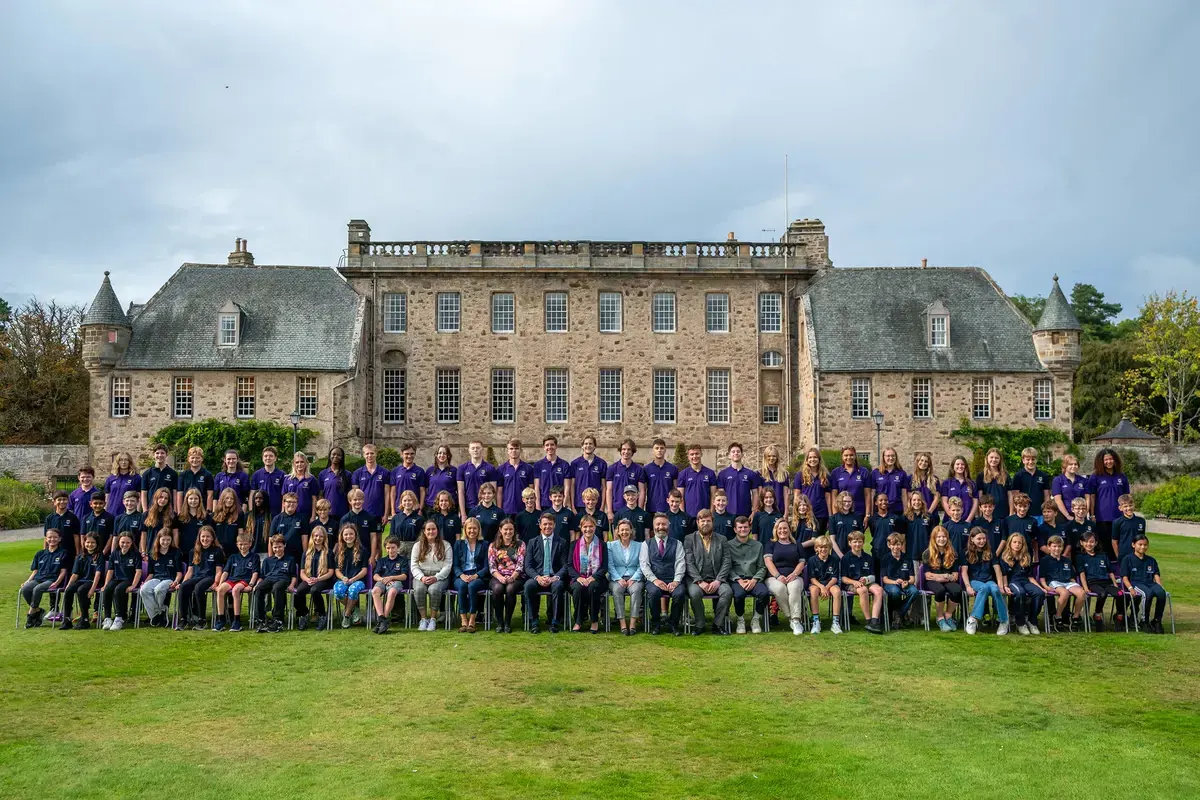 A large photo of open day and taster students pose for a formal photo in front of Gordonstoun House